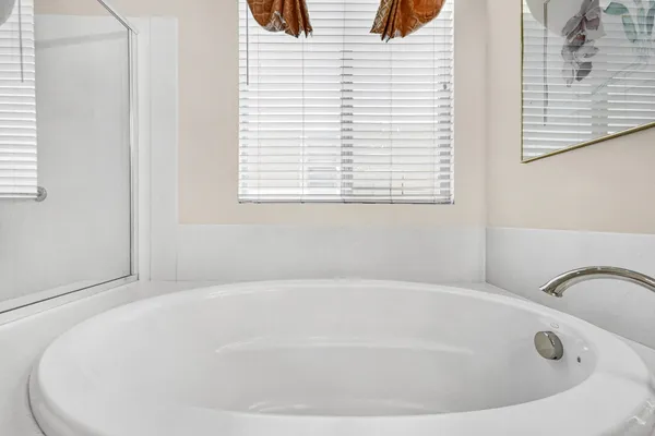 a white bath tub sitting in a bathroom