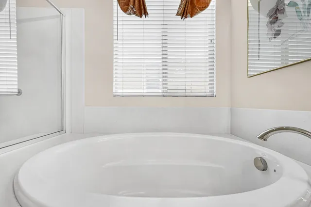 a white bath tub sitting in a bathroom