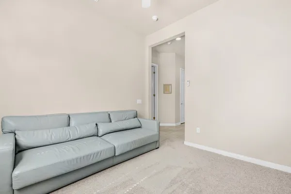 a living room with furniture and a couch