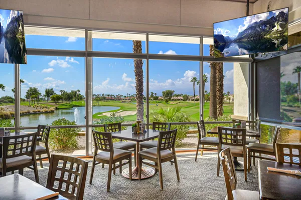 a view of a dining room with furniture window and outside view