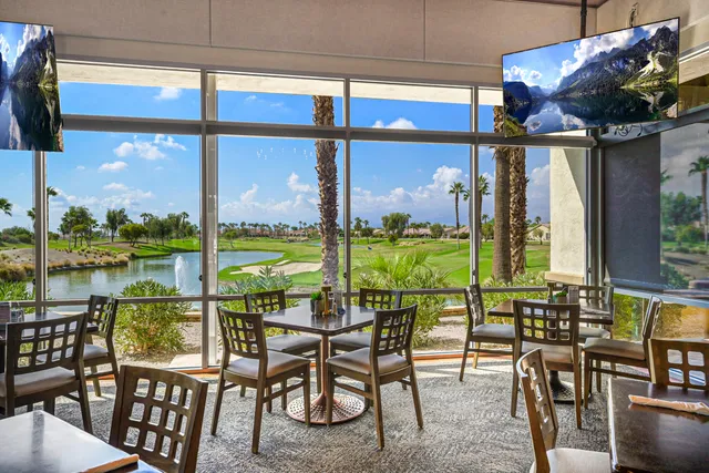 a view of a dining room with furniture window and outside view