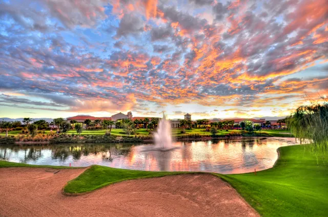 a view of a lake with houses in the back