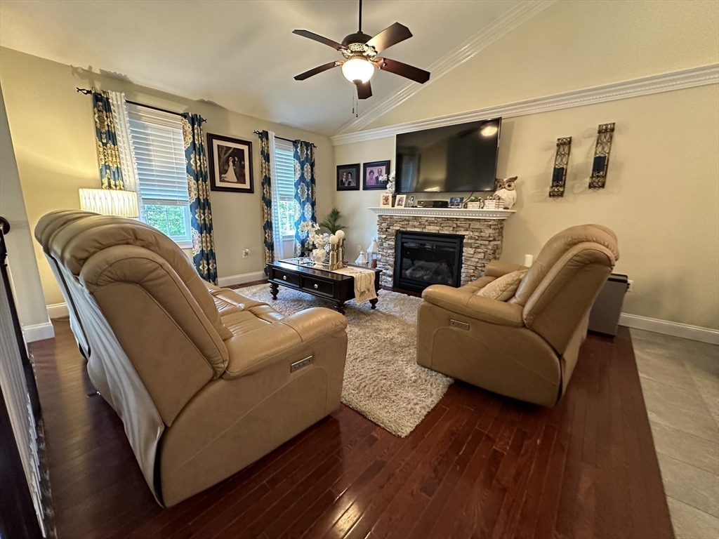 115 Bronson Fall River Fall River, MA 02724 - Photo 12 of 37 a living room with furniture a fireplace and a flat screen tv