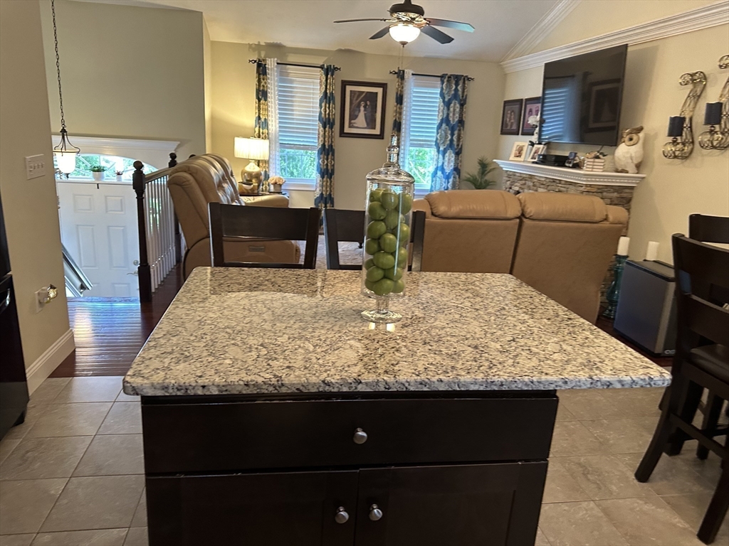 115 Bronson Fall River Fall River, MA 02724 - Photo 14 of 37 a room with kitchen island granite countertop furniture and a couch