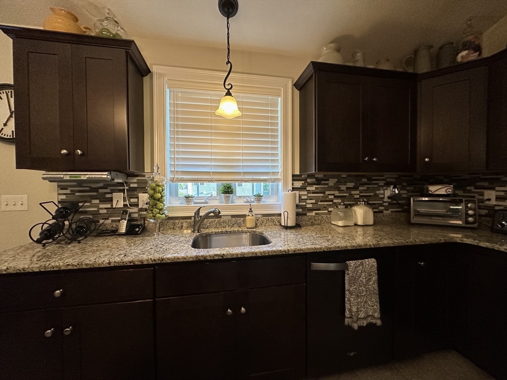 115 Bronson Fall River Fall River, MA 02724 - Photo 18 of 37 a kitchen with sink and cabinets