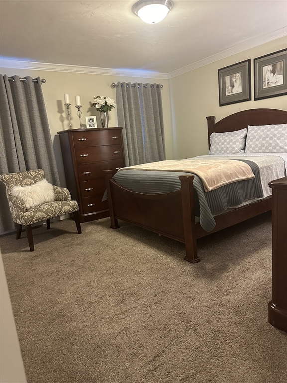 115 Bronson Fall River Fall River, MA 02724 - Photo 24 of 37 a bedroom with a bed and a mirror