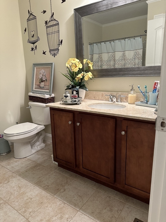115 Bronson Fall River Fall River, MA 02724 - Photo 25 of 37 a bathroom with a toilet sink and mirror