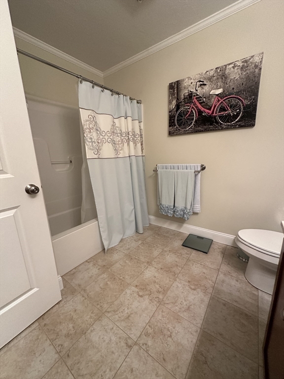 115 Bronson Fall River Fall River, MA 02724 - Photo 26 of 37 a bathroom with a toilet and a tub