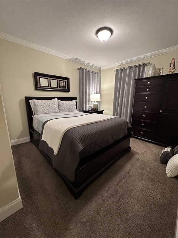 115 Bronson Fall River Fall River, MA 02724 - Photo 27 of 37 a spacious bedroom with a bed and a dresser
