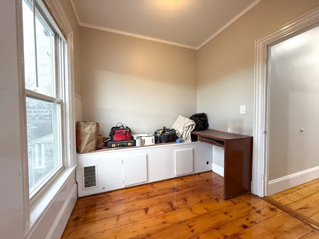 a view of a cabinet and a window in a room