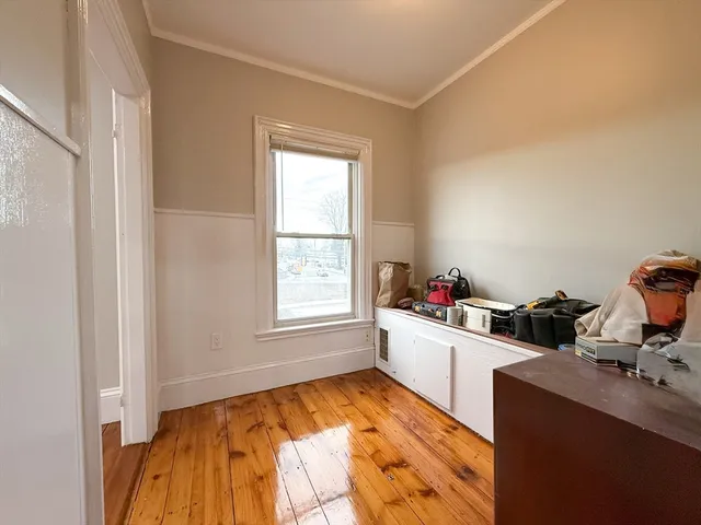 a room with a bed and a window