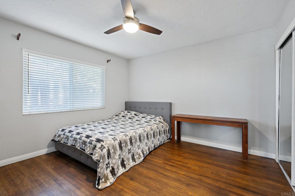 2440 Dunstan Street Oceanside, CA 92054 - Photo 21 of 29 a bedroom with a bed and a night stand