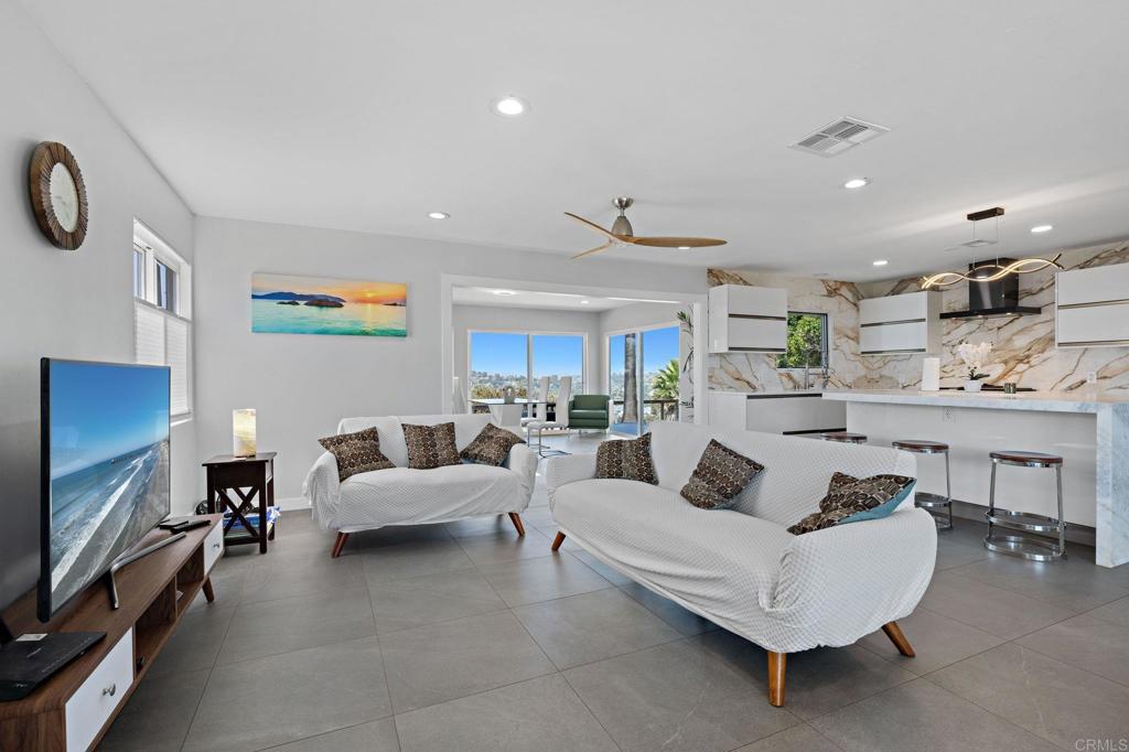 2440 Dunstan Street Oceanside, CA 92054 - Photo 7 of 29 a living room with furniture and a flat screen tv