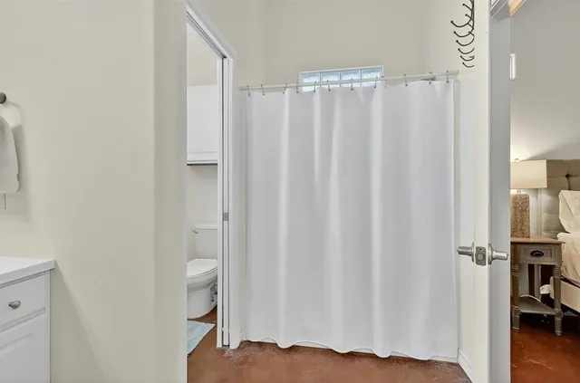 a view of a chairs and table in the back yard of the house