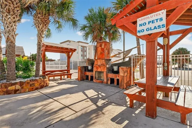 a patio with a patio table and chairs