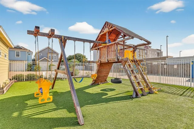 a couple of potted plants in front of door