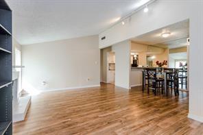 12802 Midway Road, Unit 2003 Dallas, TX 75244 - Photo 14 of 28 a view of dining room with furniture and wooden floor