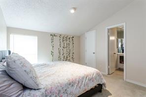 12802 Midway Road, Unit 2003 Dallas, TX 75244 - Photo 21 of 28 a spacious bedroom with a bed and a window