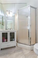 12802 Midway Road, Unit 2003 Dallas, TX 75244 - Photo 24 of 28 a bathroom with a sink a toilet and shower