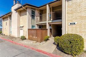 12802 Midway Road, Unit 2003 Dallas, TX 75244 - Photo 25 of 28 a front view of a house with a yard