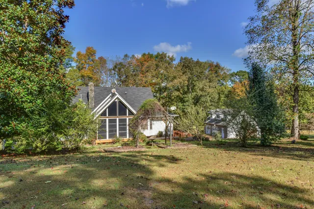 a view of a hall with sitting area