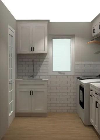 a stove top oven sitting inside of a kitchen