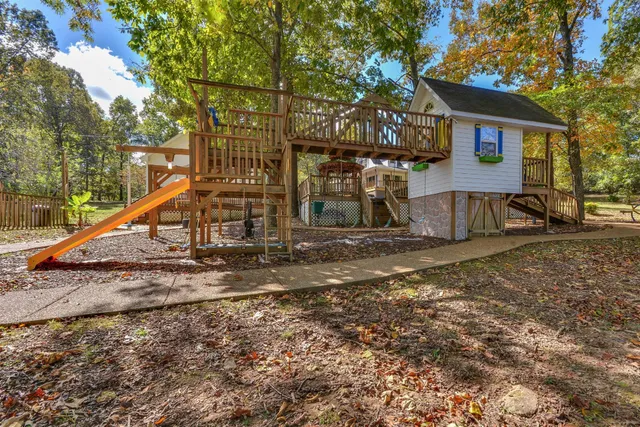 a view of a backyard with sitting area