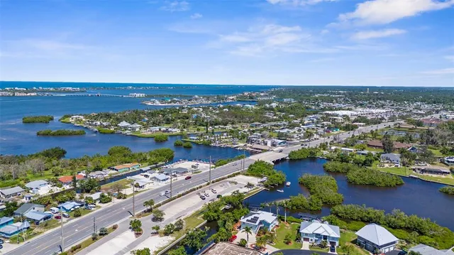 an aerial view of a city with lake view
