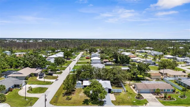 an aerial view of residential houses with outdoor space
