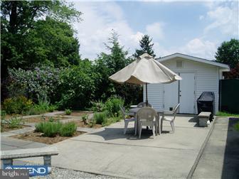 24 Shady Lane Road Clarksboro, NJ 08020 - Photo 9 of 12 a view of a patio with a table and chairs under an umbrella
