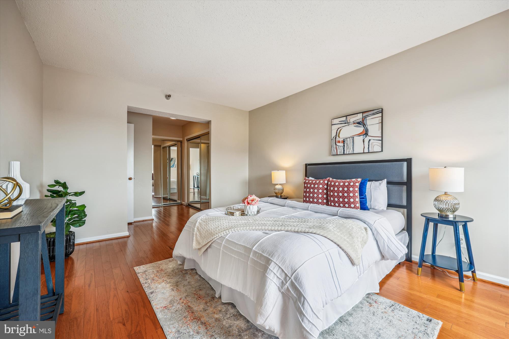 5800 Nicholson Lane, Unit 1908 Rockville, MD 20852 - Photo 11 of 35 a bedroom with a bed and wooden floor