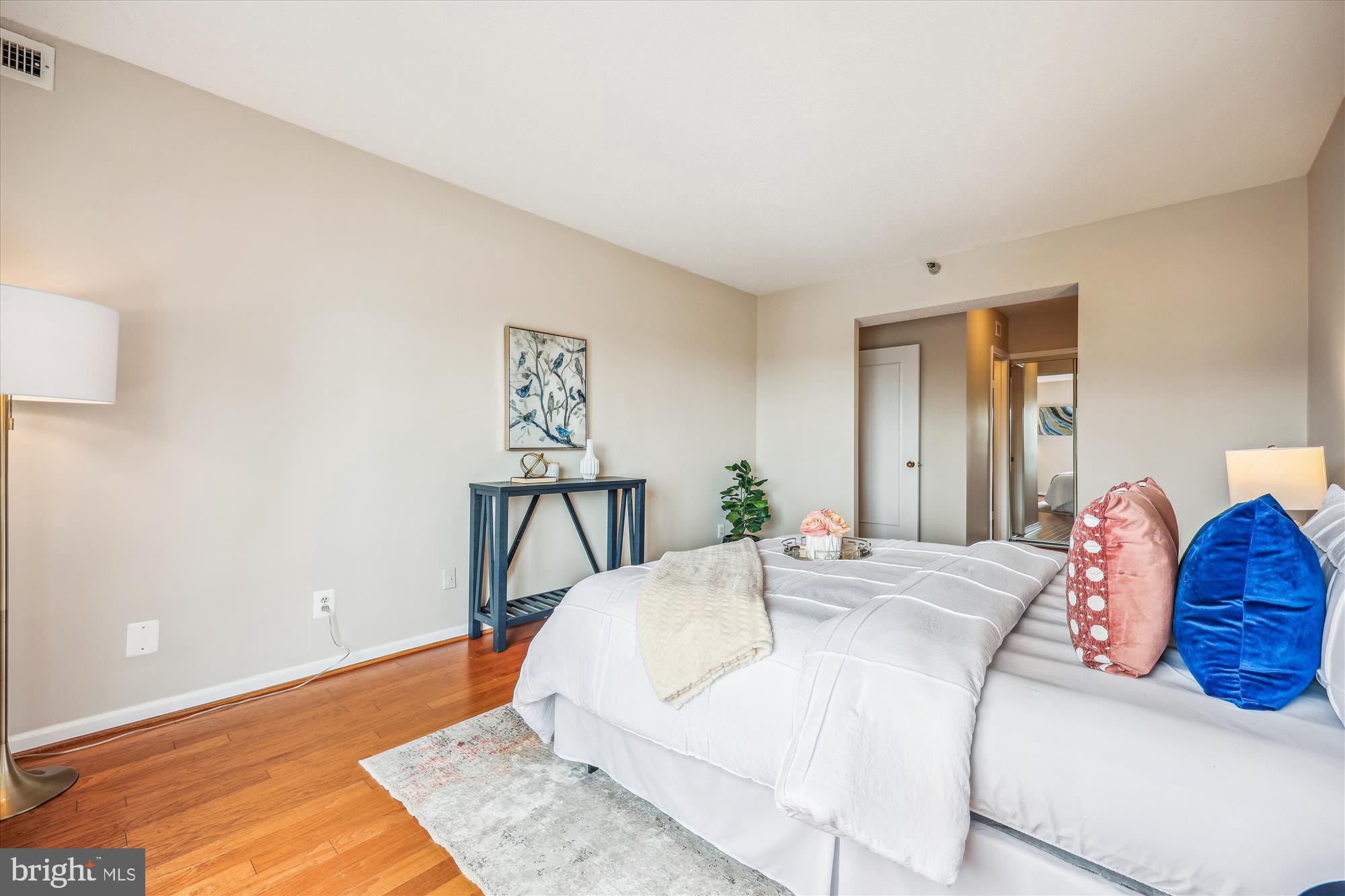 5800 Nicholson Lane, Unit 1908 Rockville, MD 20852 - Photo 12 of 35 a bedroom with a bed and wooden floor