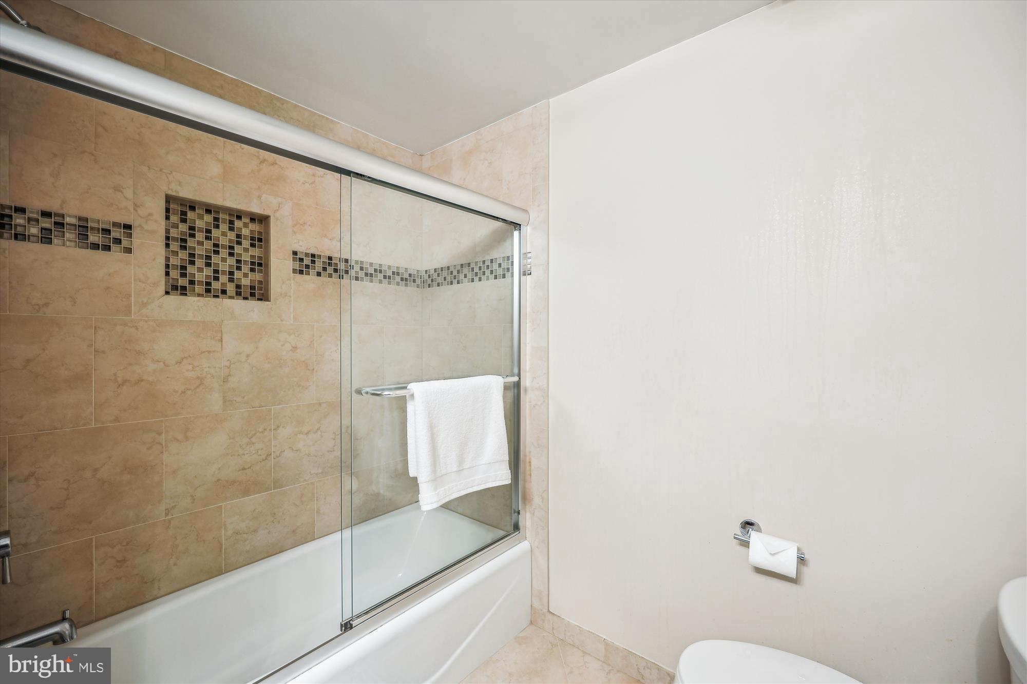 5800 Nicholson Lane, Unit 1908 Rockville, MD 20852 - Photo 13 of 35 a bathroom with a shower and toilet
