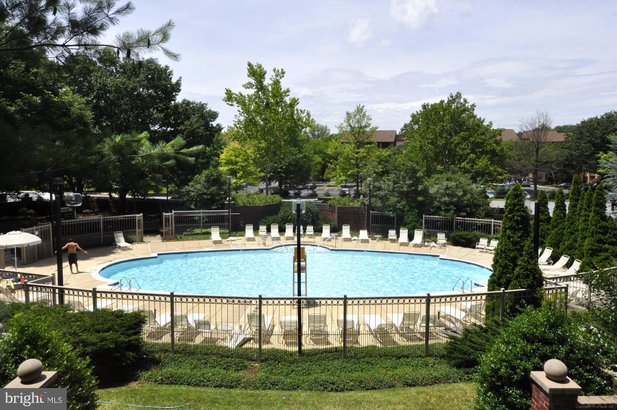 5800 Nicholson Lane, Unit 1908 Rockville, MD 20852 - Photo 30 of 35 a view of swimming pool with seating space and trees in the background