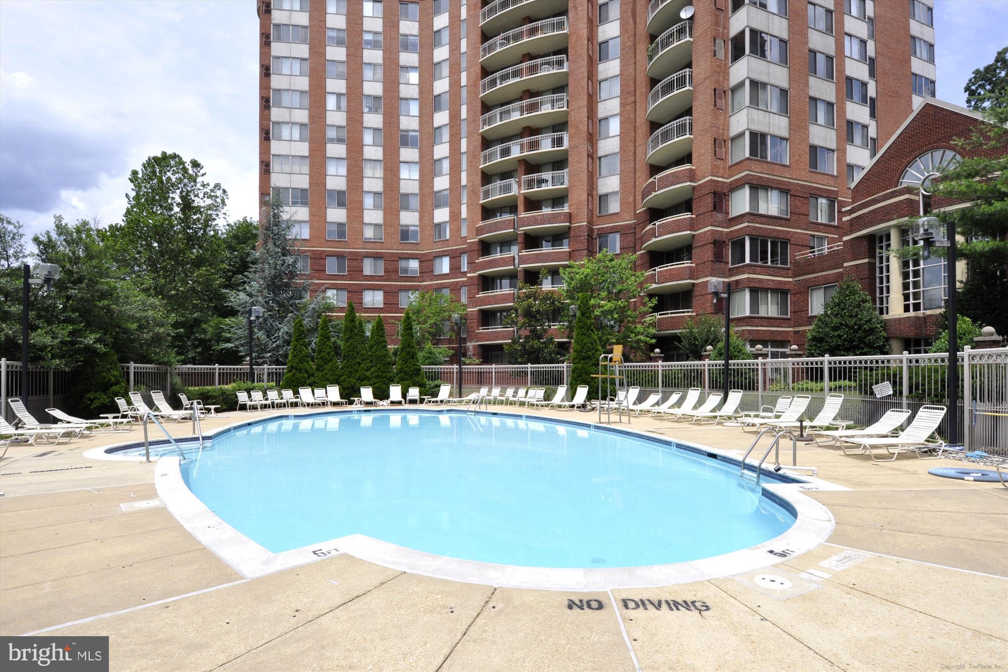 5800 Nicholson Lane, Unit 1908 Rockville, MD 20852 - Photo 31 of 35 a view of a swimming pool and a buildings
