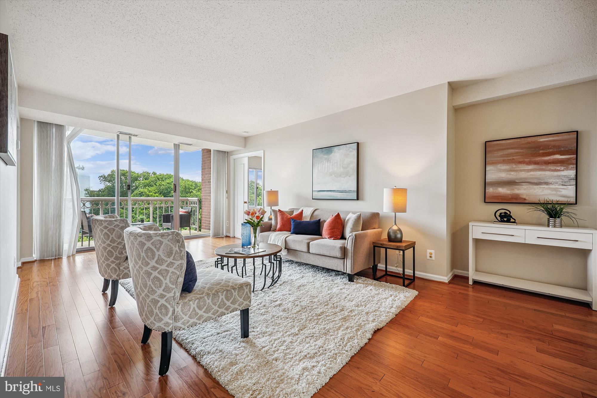5800 Nicholson Lane, Unit 1908 Rockville, MD 20852 - Photo 4 of 35 a living room with furniture and a large window
