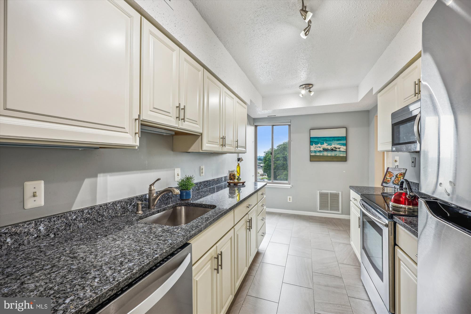 5800 Nicholson Lane, Unit 1908 Rockville, MD 20852 - Photo 7 of 35 a kitchen with stainless steel appliances granite countertop a sink stove and cabinets