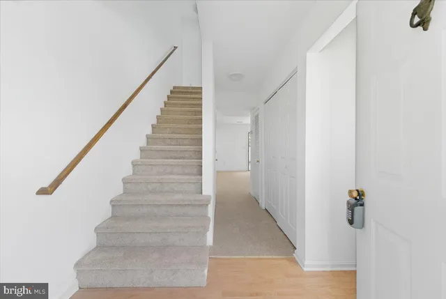 a view of walk in closet with clothes