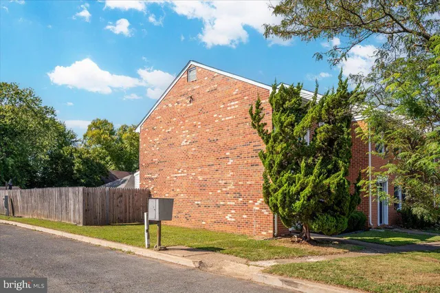 a view of a house with palm trees