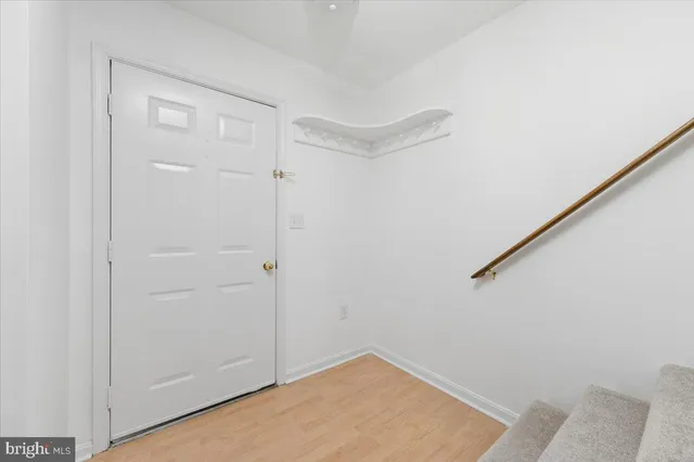 a view of entryway with wooden floor