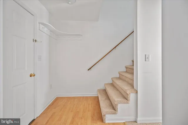 a view of staircase with white walls