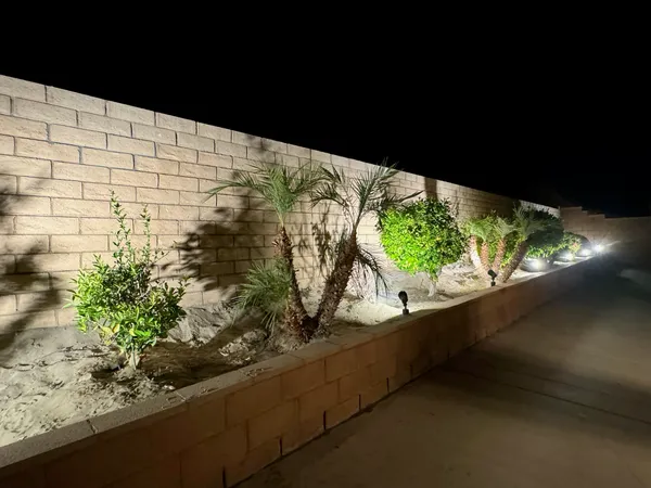 a view of a garden from a balcony