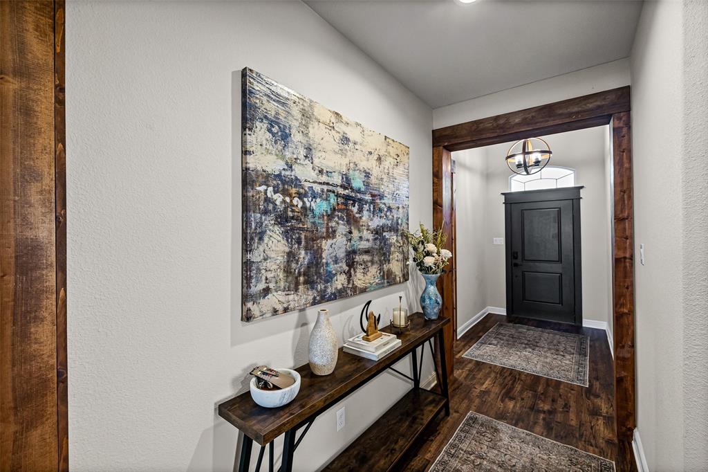 2373 Briscoe Rnch Drive Weatherford, TX 76087 - Photo 14 of 38 a view of a hallway and a livingroom with furniture