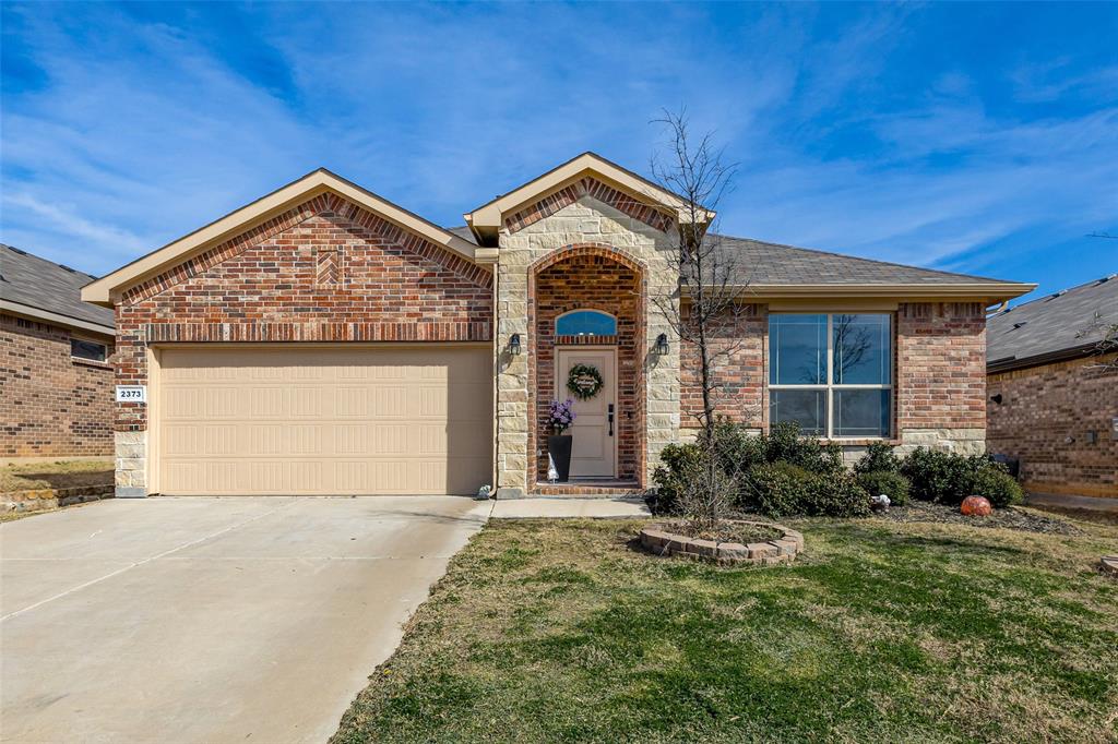 2373 Briscoe Rnch Drive Weatherford, TX 76087 - Photo 2 of 38 a front view of a house with garden