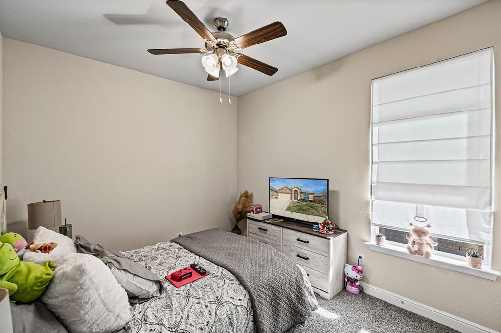 2373 Briscoe Rnch Drive Weatherford, TX 76087 - Photo 21 of 38 a bedroom with a bed and a large window with the outer view