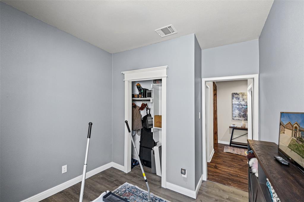 2373 Briscoe Rnch Drive Weatherford, TX 76087 - Photo 23 of 38 a view of a room with wooden floor and closet