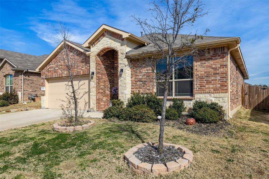 2373 Briscoe Rnch Drive Weatherford, TX 76087 - Photo 3 of 38 a front view of a house with garden