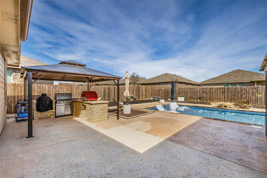 2373 Briscoe Rnch Drive Weatherford, TX 76087 - Photo 33 of 38 a view of a swimming pool with seating space