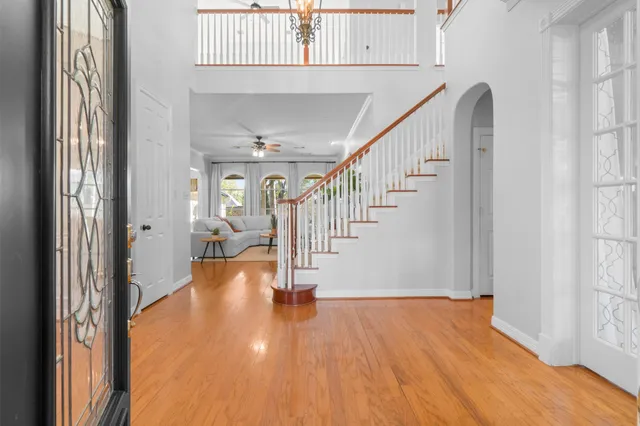 a view of an entryway with wooden floor
