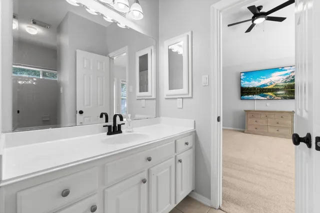 a bathroom with a sink a mirror and a bathtub